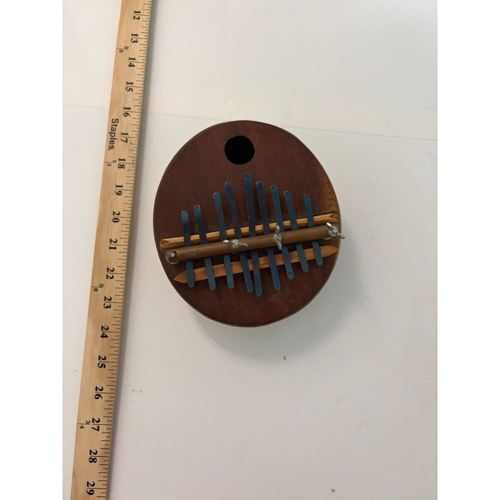 Vintage African Kalimba thumb piano with wooden board and metal tines